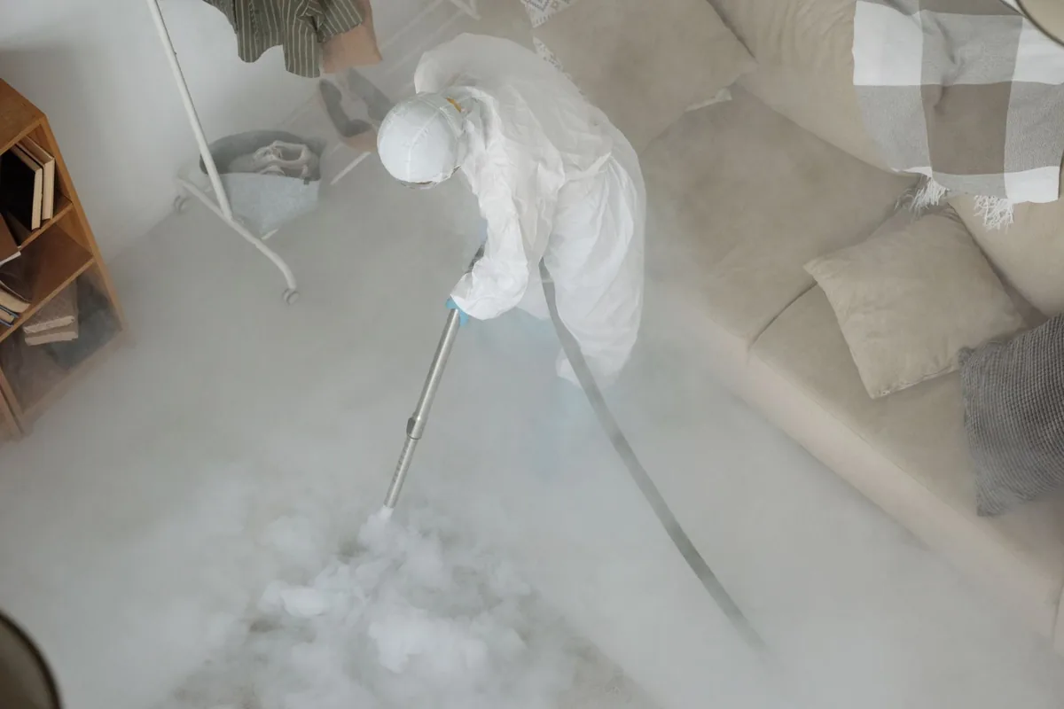Biohazard cleanup technician in protective equipment, Westlake, LA